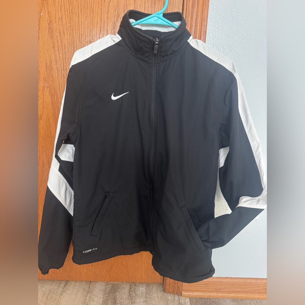 Nike storm fit, medium zip up black with white stripe on sleeve